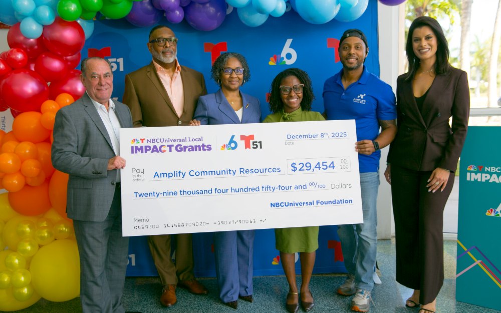 ACR team receiving the NBCUniversal Local Impact Grant check