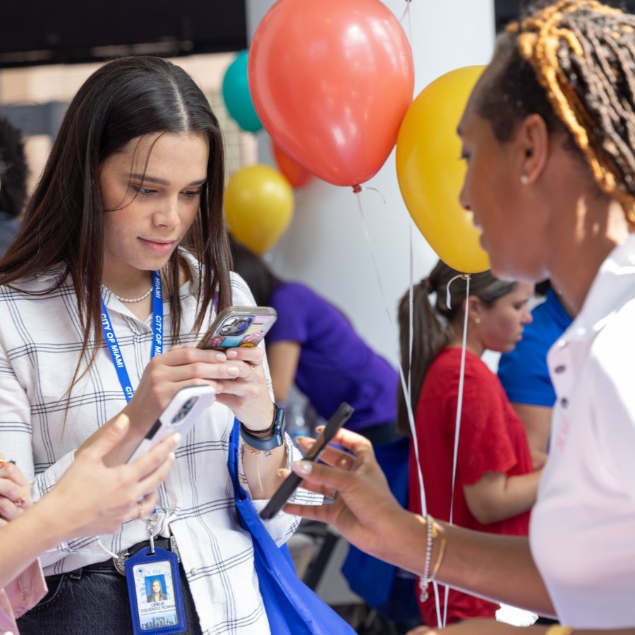 Attendees sharing ACR information at an event